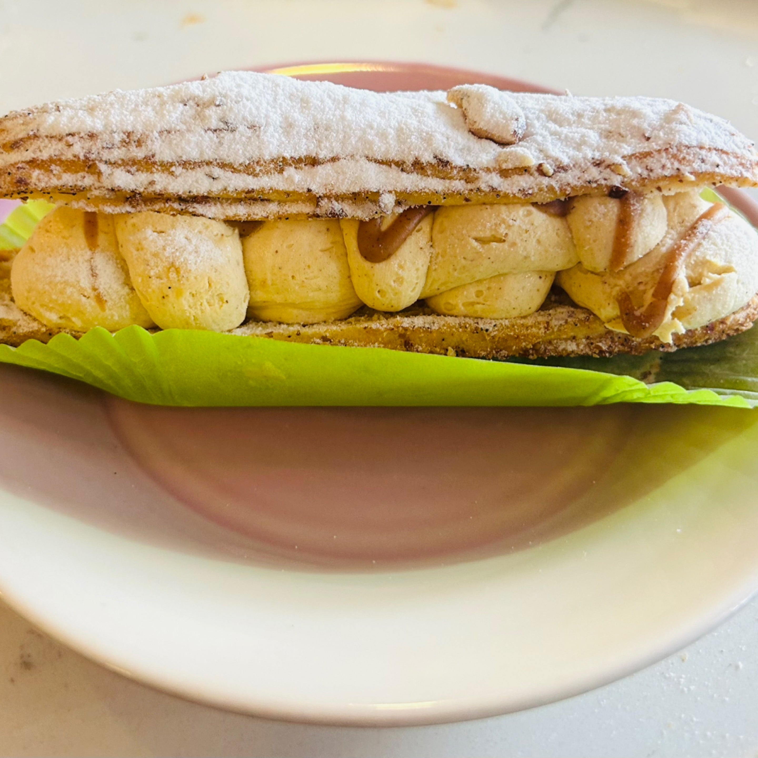 Paris-Brest éclair on the counter at Éclair, Hampton