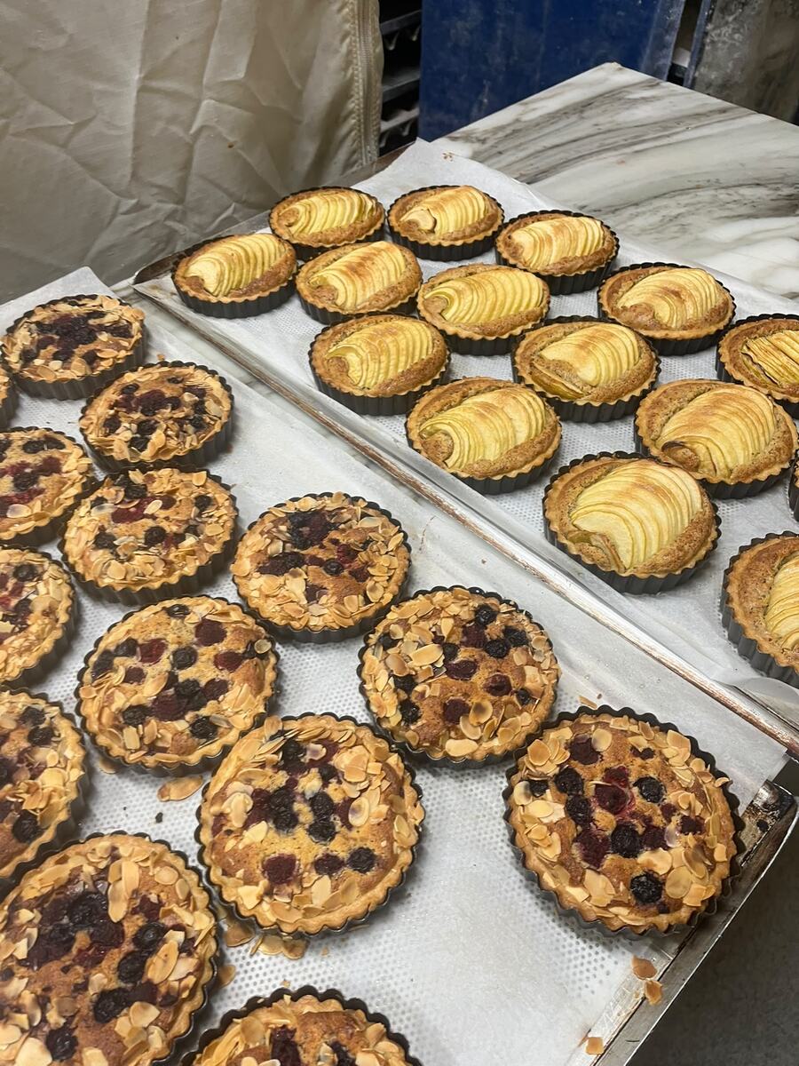 Freshly baked fruit and apple tarts at Éclair Boulangerie, Hampton